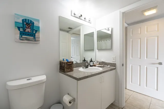 a view of a house with a yard and lake view