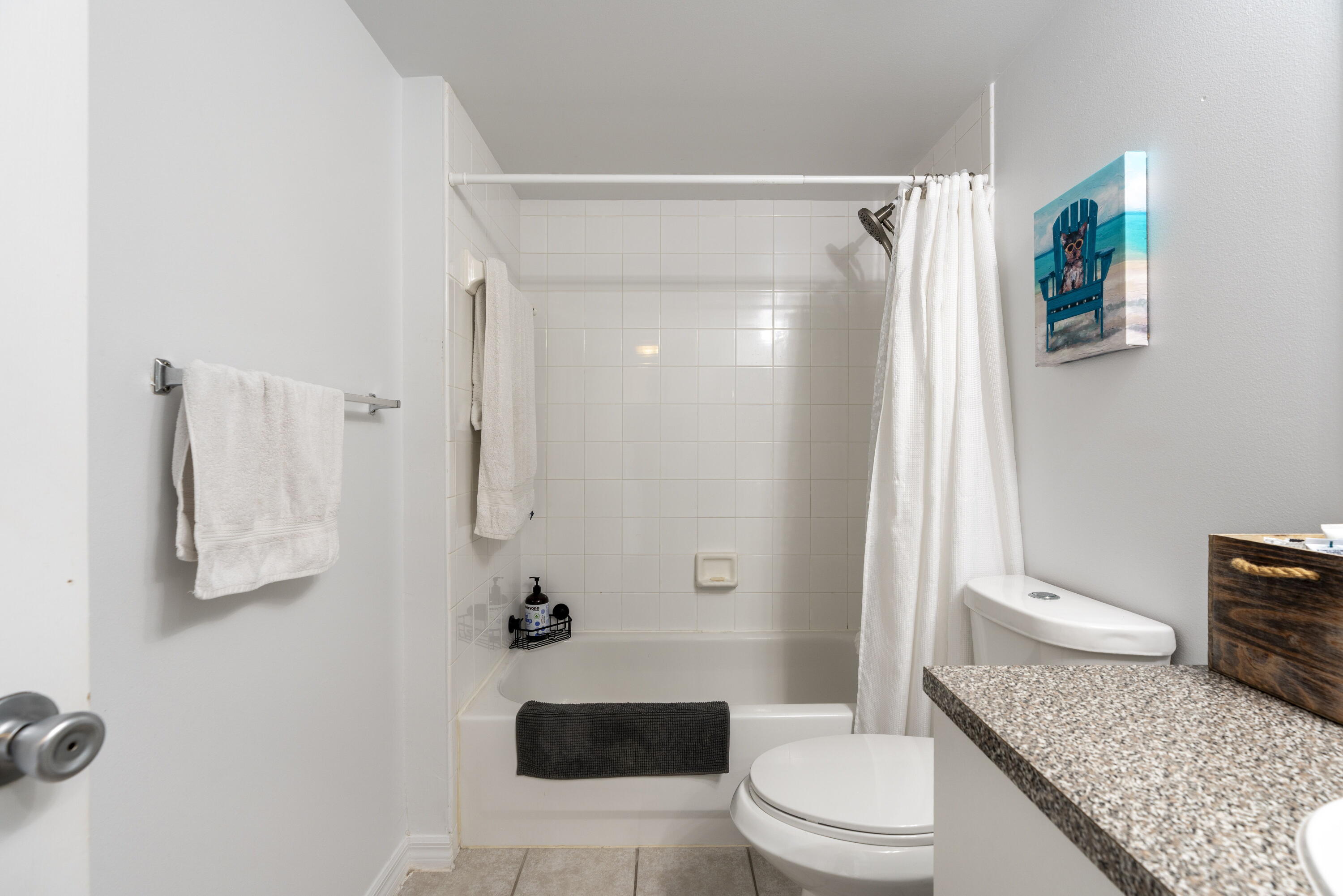 5031 Wiles Road, Unit 304 Coconut Creek, FL 33073 - Photo 48 of 55 a bathroom with a granite countertop sink toilet and shower