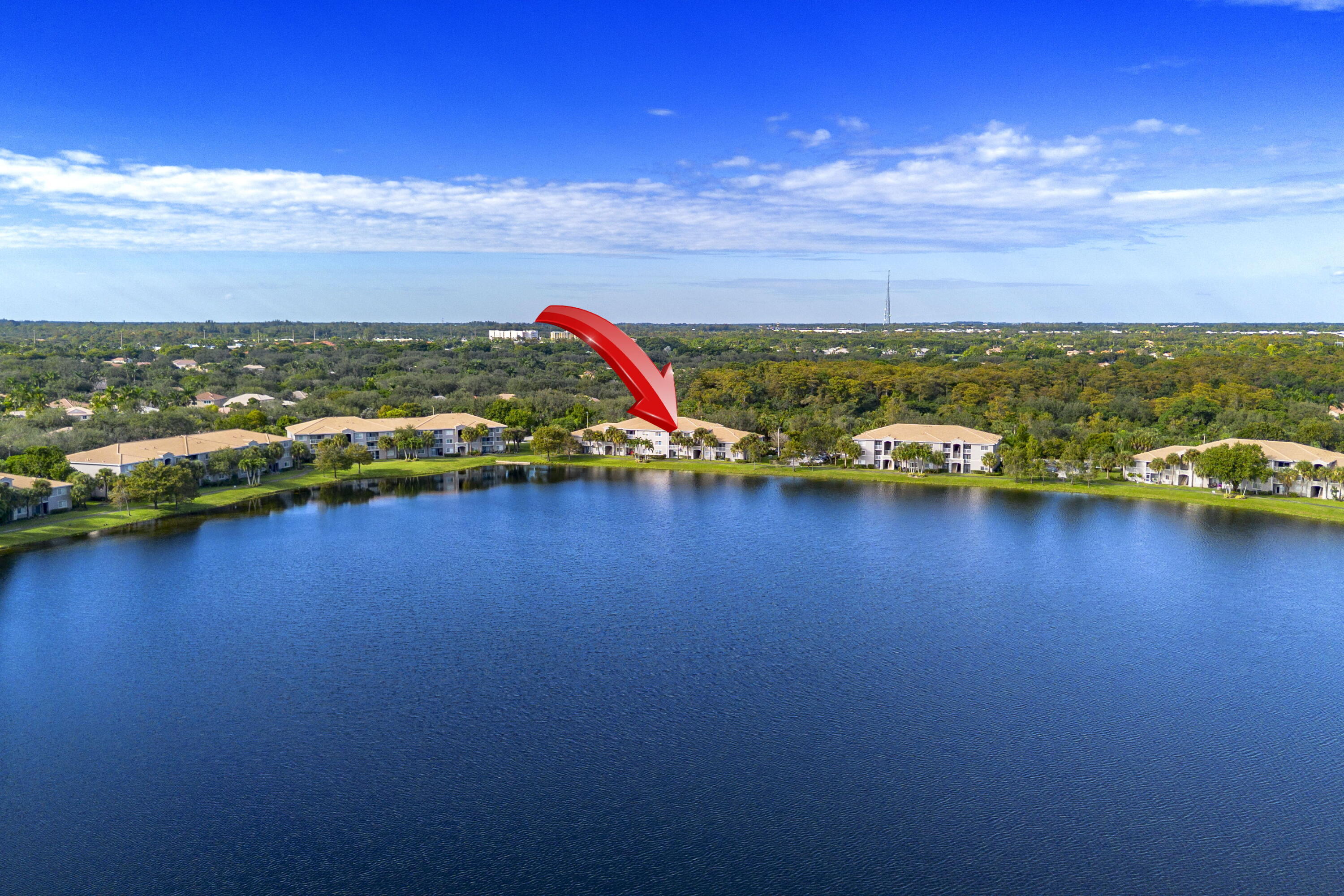 5031 Wiles Road, Unit 304 Coconut Creek, FL 33073 - Photo 52 of 55 a view of a lake with houses