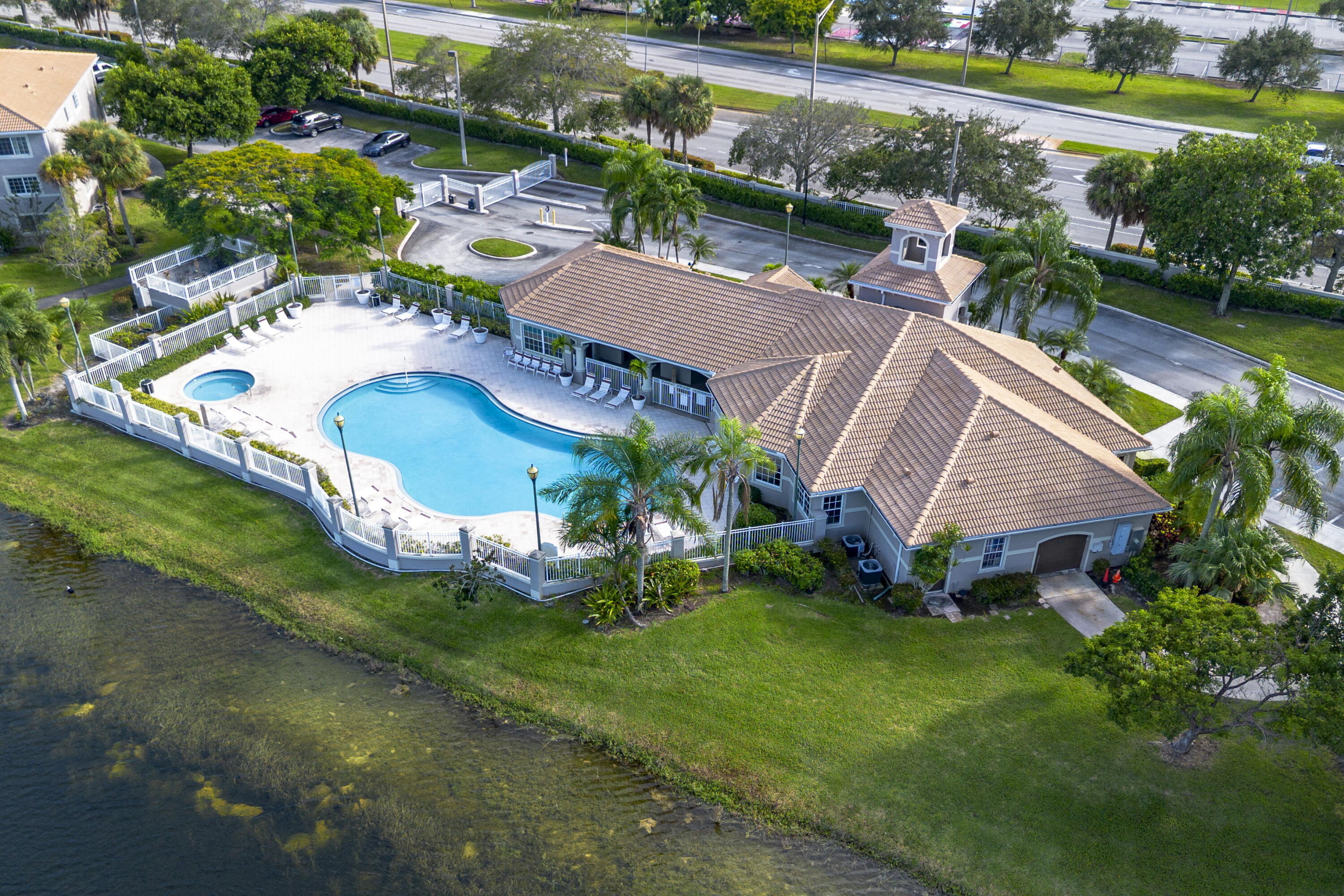 5031 Wiles Road, Unit 304 Coconut Creek, FL 33073 - Photo 54 of 55 an aerial view of a house with garden space and street view