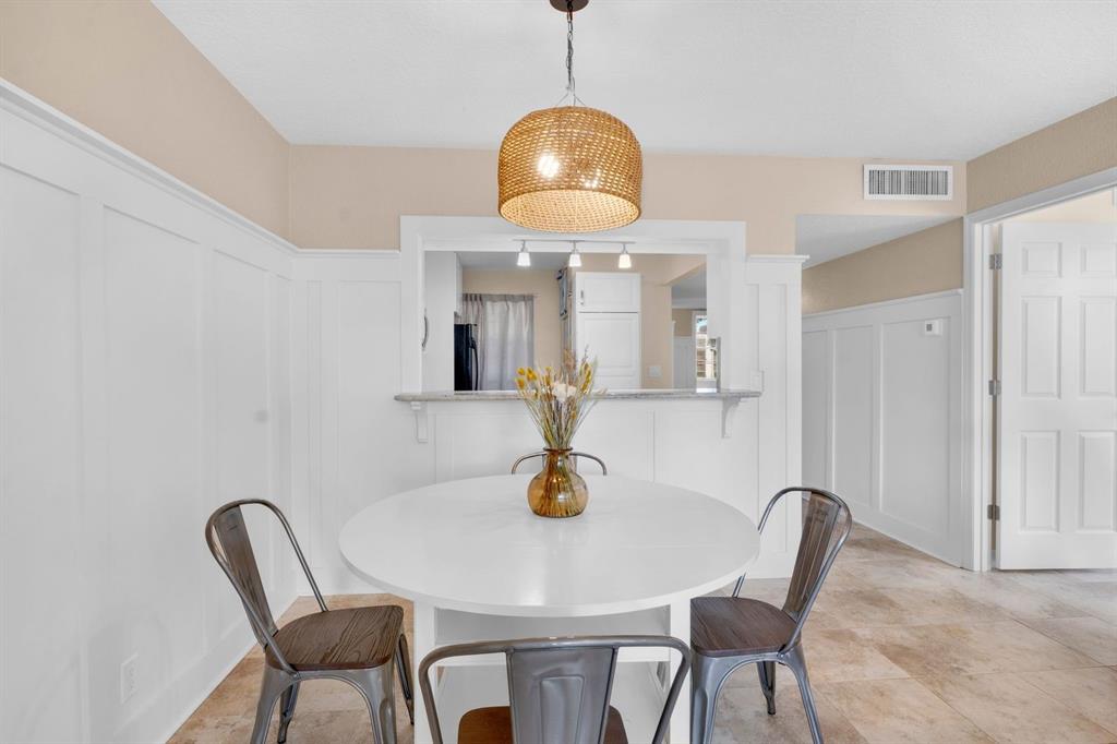 9330 Lagoon Place, Unit 209 Davie, FL 33324 - Photo 7 of 14 a view of a dining room with a table and chairs