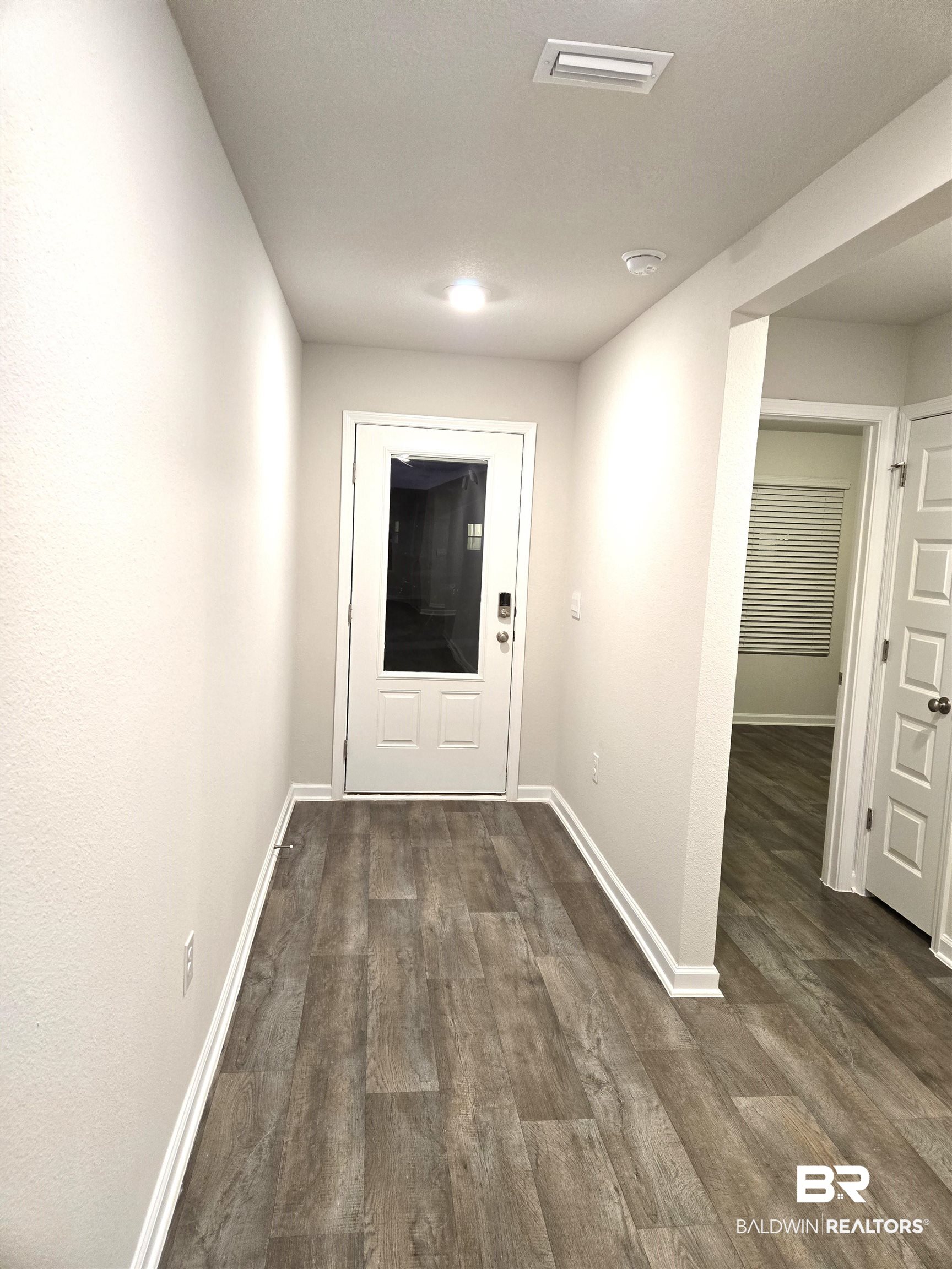 24194 Veranda Circle Elberta, AL 36530 - Photo 4 of 31 Hall with dark hardwood / wood-style floors