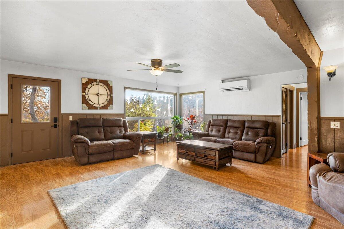 1360 Oxyoke Road Grants Pass, OR 97526 - Photo 18 of 39 a living room with furniture and a large window