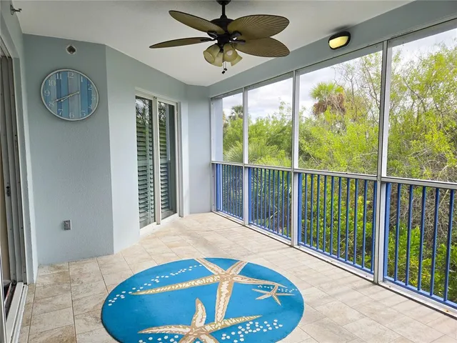 a view of a balcony with furniture