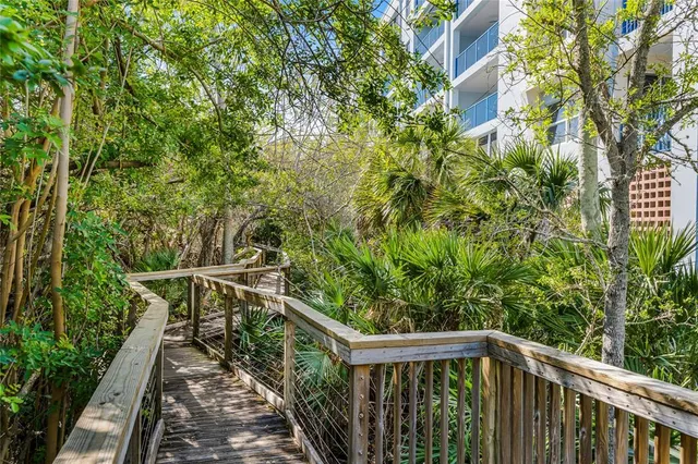 an aerial view of a house with garden space and street view