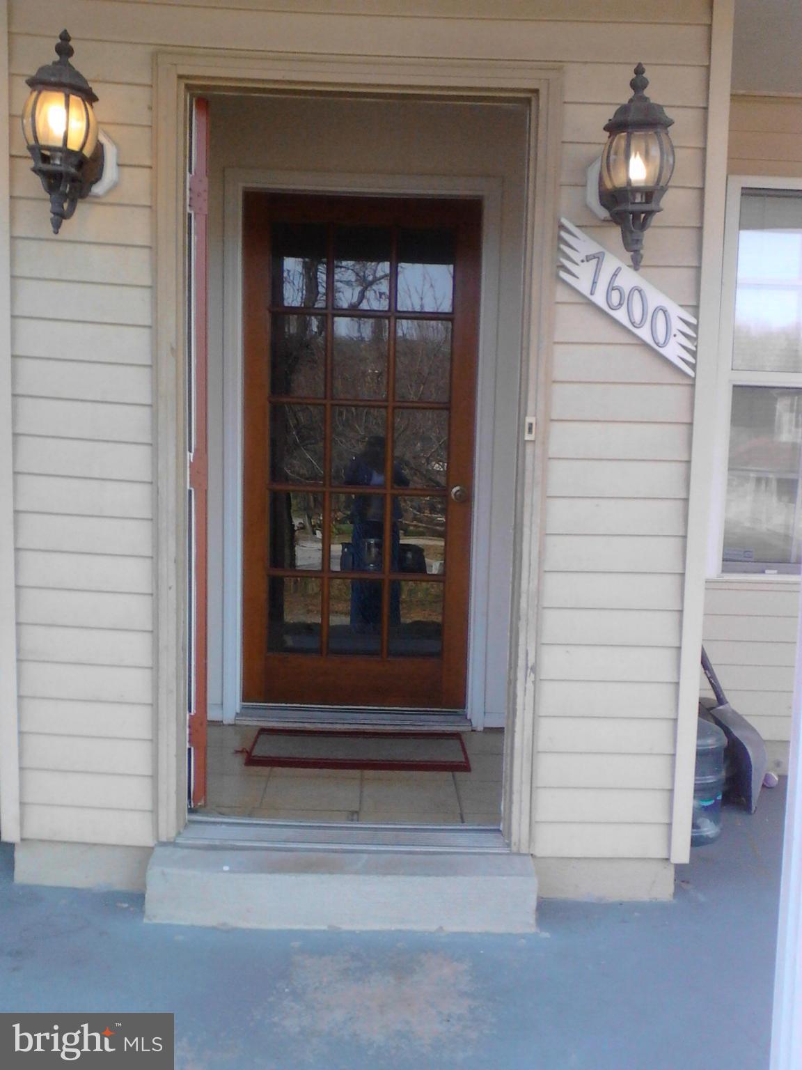 7600 Fox Hunt Court Clinton, MD 20735 - Photo 2 of 13 a view of a entryway door of the house and front door