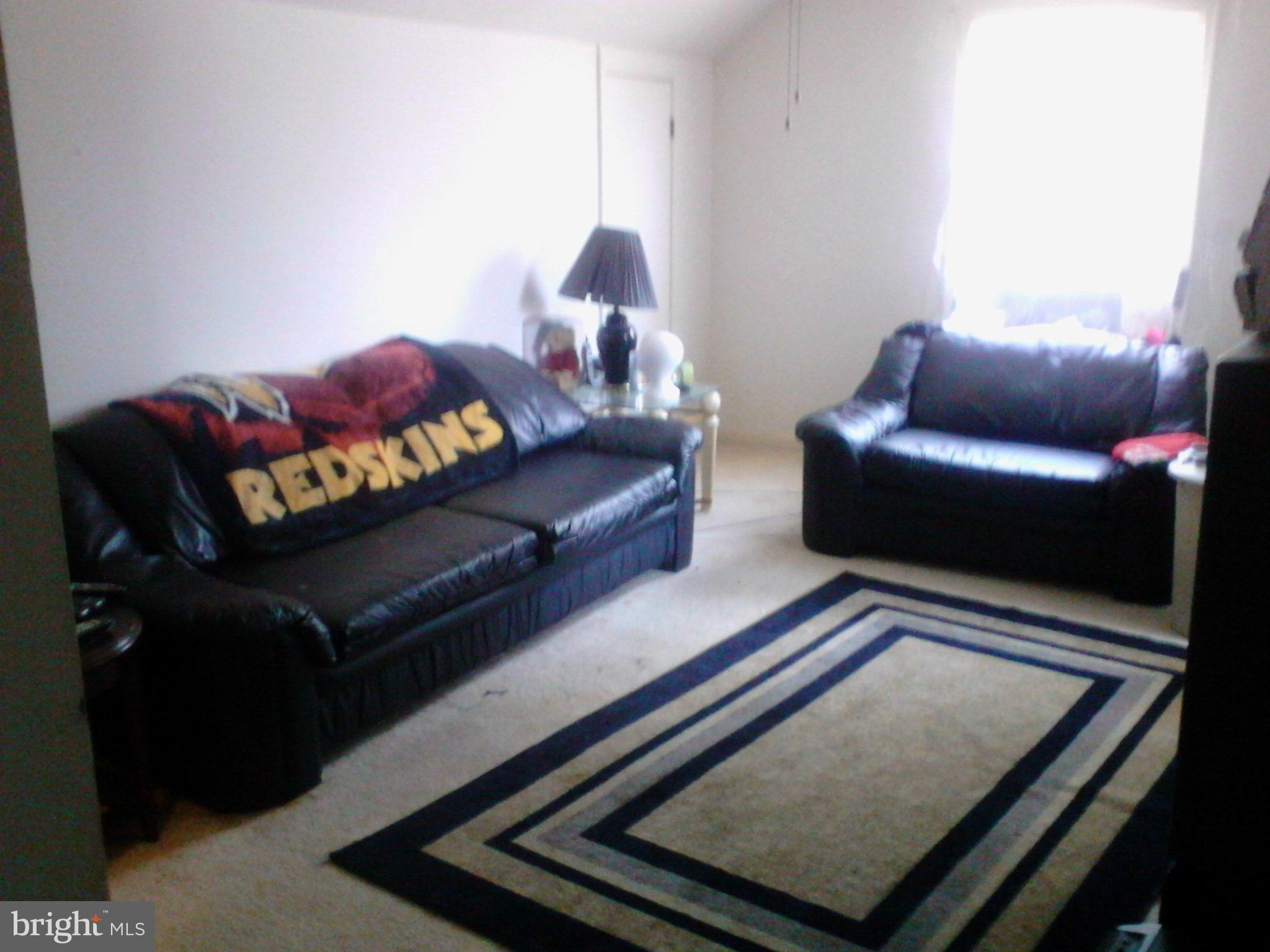 7600 Fox Hunt Court Clinton, MD 20735 - Photo 10 of 13 a living room with furniture and a couch