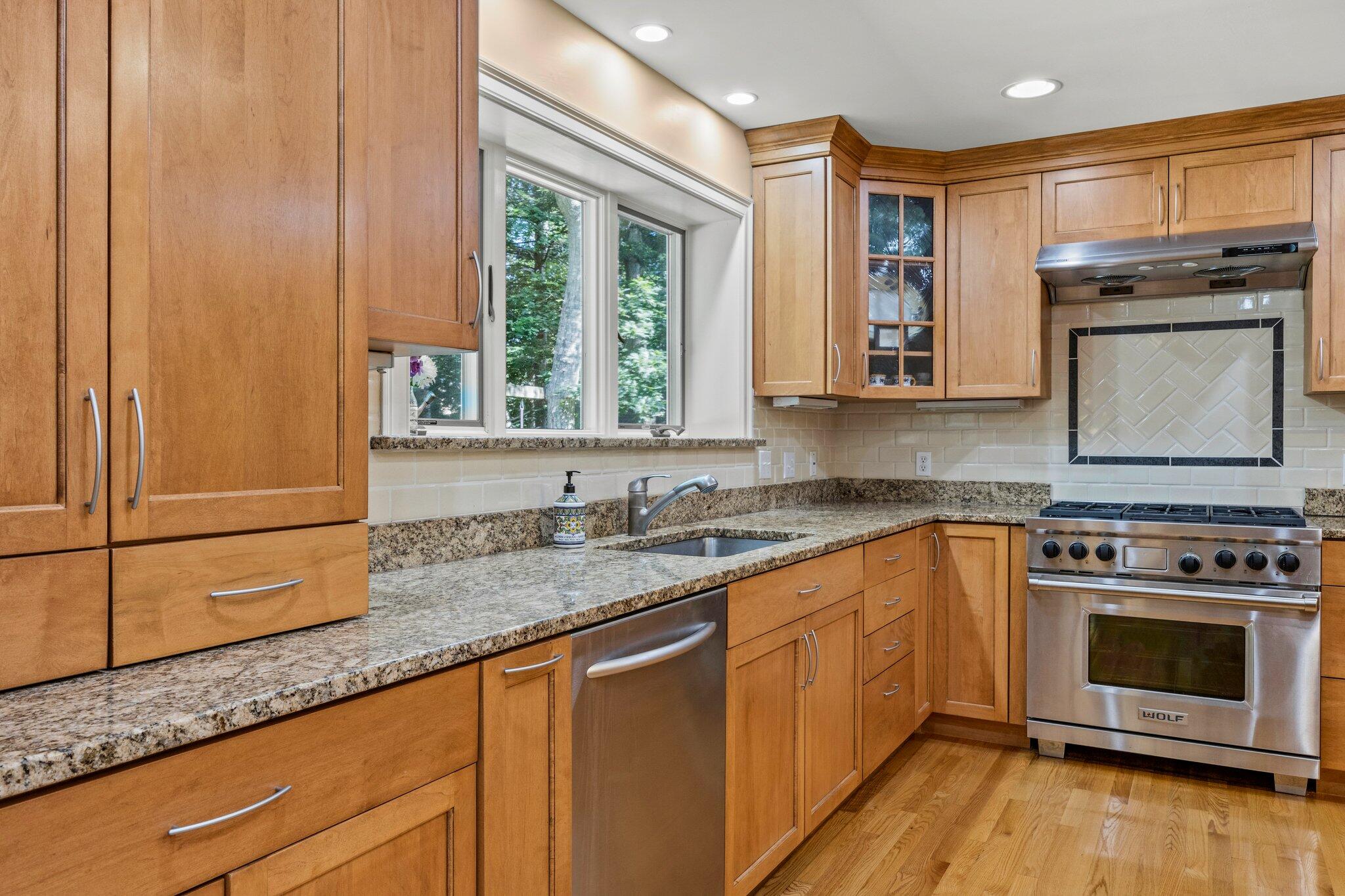 35 Angus Way Centerville, MA 02632 - Photo 14 of 62 a kitchen with granite countertop a stove a sink and a counter space