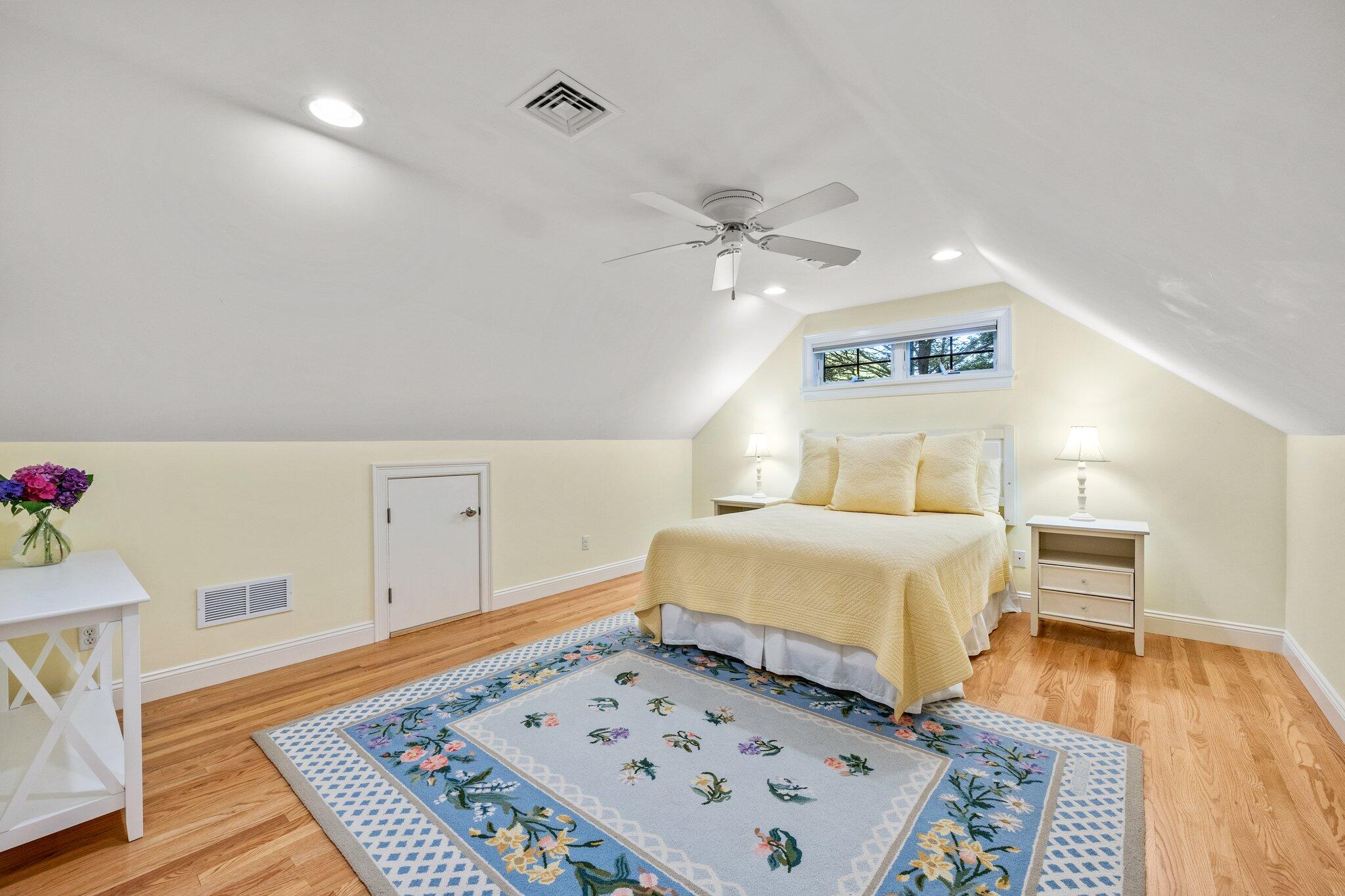 35 Angus Way Centerville, MA 02632 - Photo 24 of 62 a bedroom with a bed and a table in it