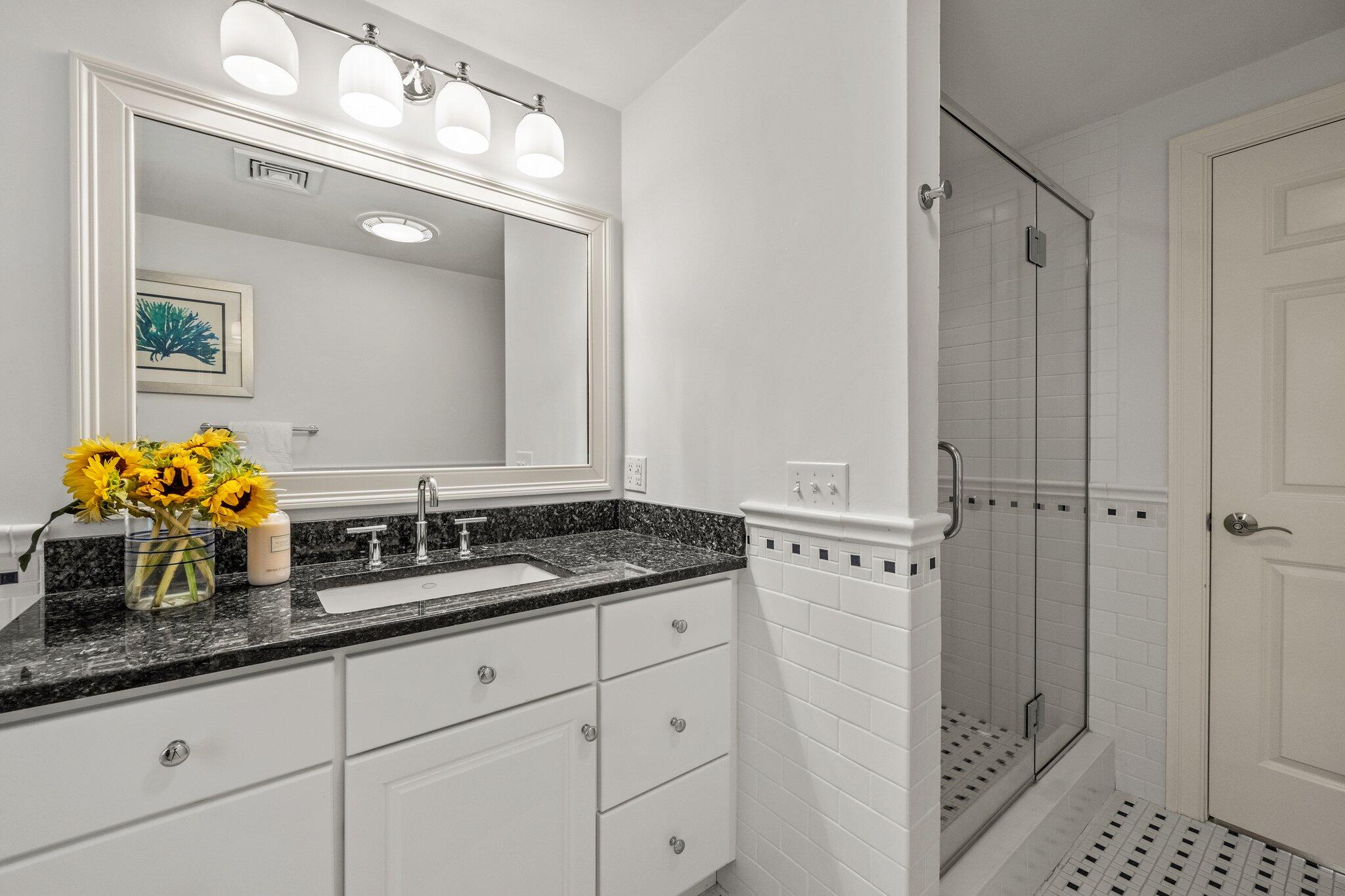 35 Angus Way Centerville, MA 02632 - Photo 26 of 62 a bathroom with a granite countertop sink vanity granite and a mirror
