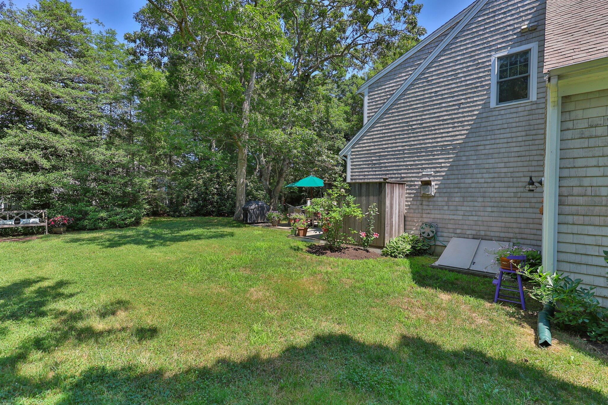 35 Angus Way Centerville, MA 02632 - Photo 37 of 62 a view of a house with backyard and sitting area