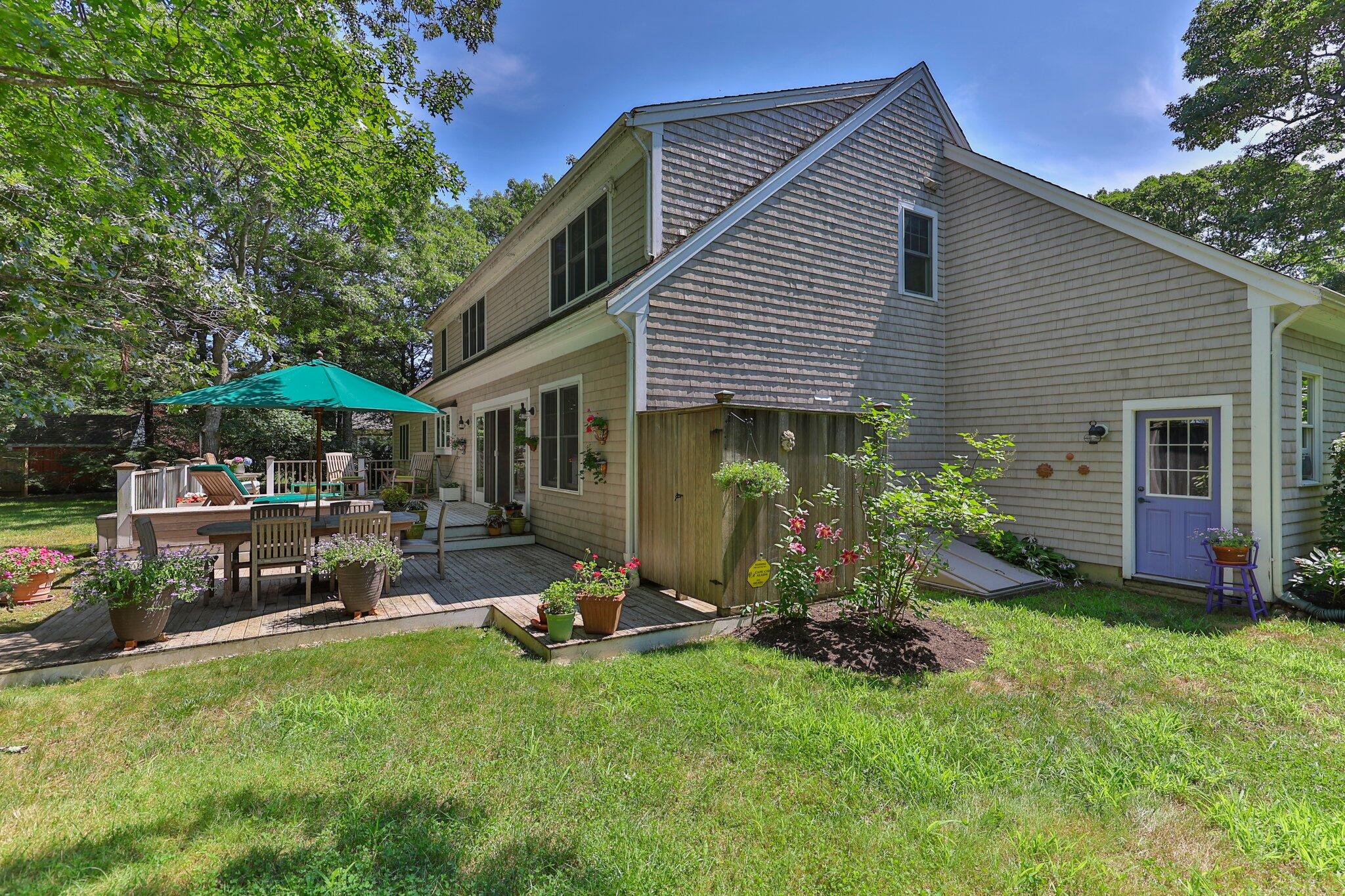35 Angus Way Centerville, MA 02632 - Photo 38 of 62 a front view of a house with a garden