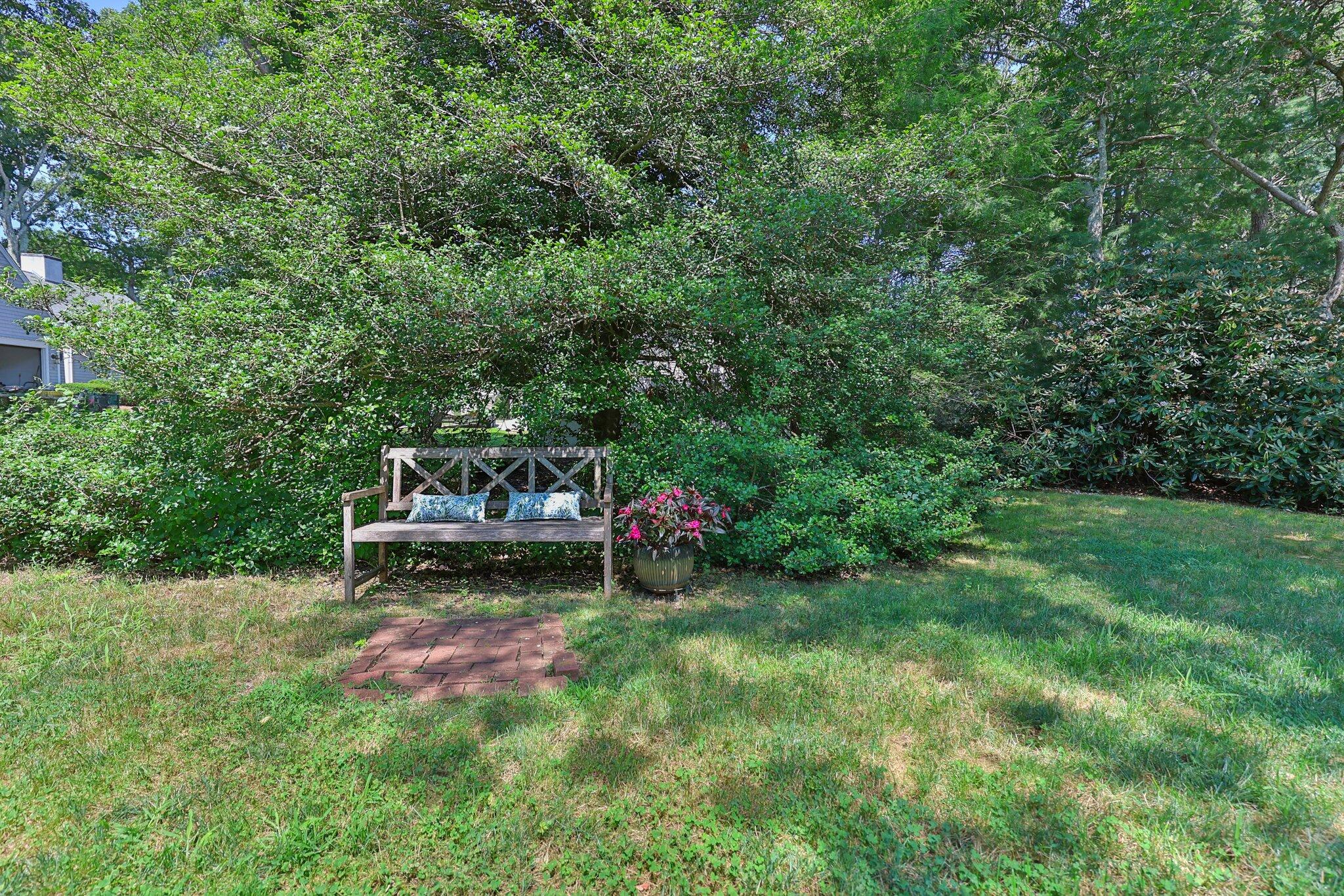 35 Angus Way Centerville, MA 02632 - Photo 40 of 62 a view of a bench in a garden