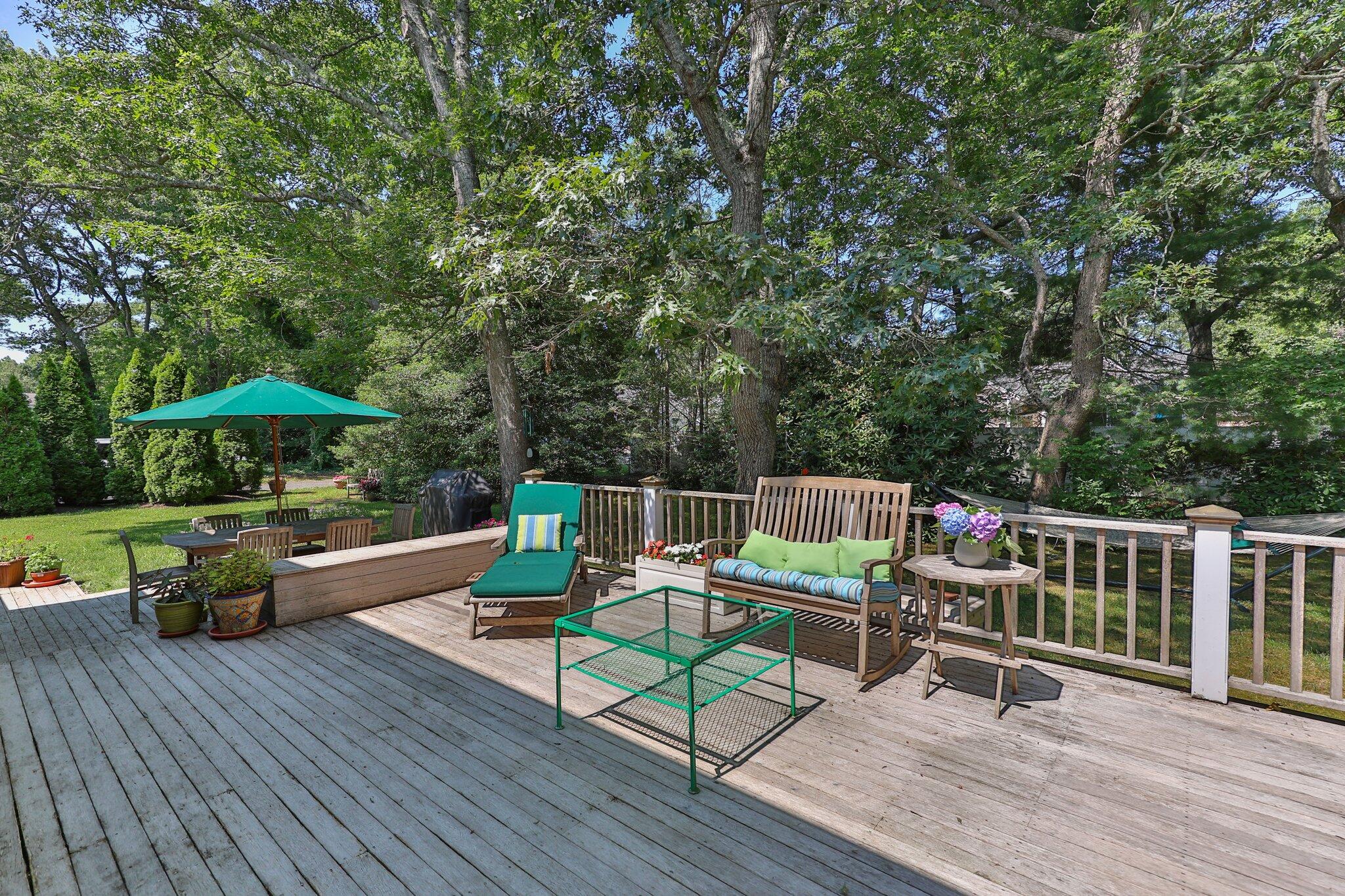 35 Angus Way Centerville, MA 02632 - Photo 43 of 62 a view of a deck with furniture and wooden floor