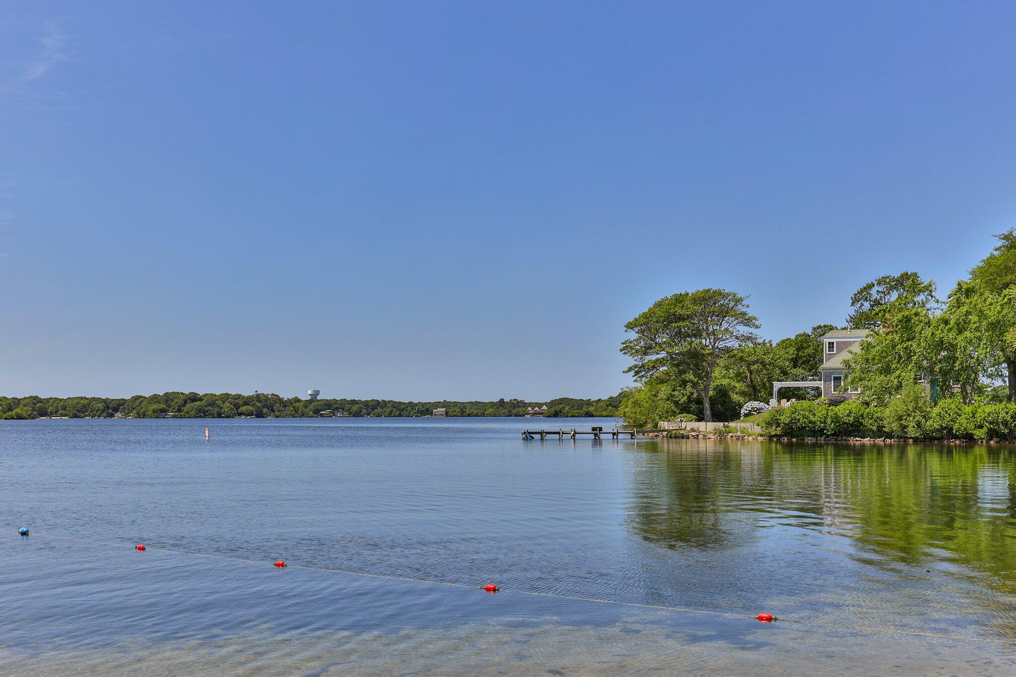 35 Angus Way Centerville, MA 02632 - Photo 50 of 62 a view of a lake with houses in the back