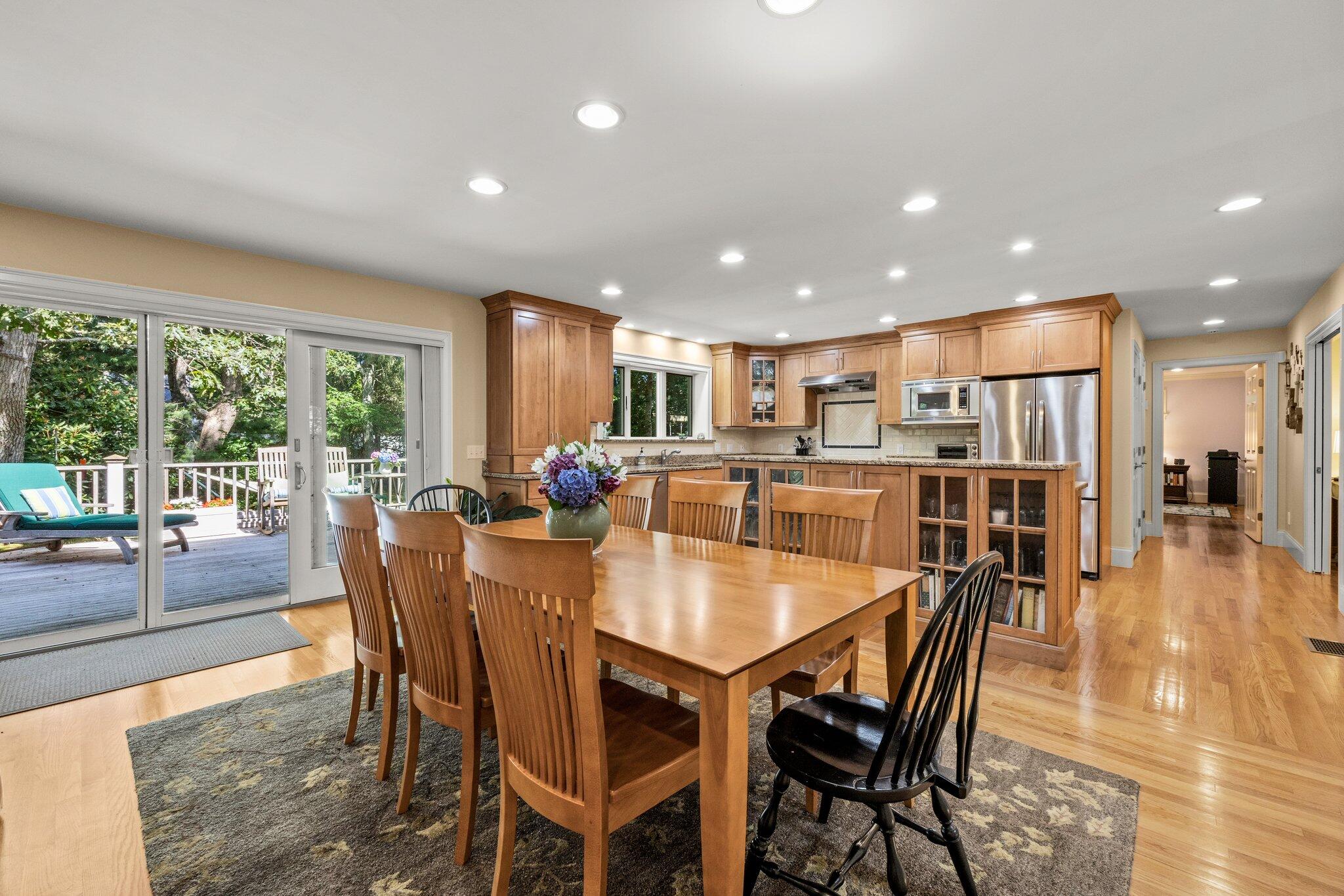 35 Angus Way Centerville, MA 02632 - Photo 5 of 62 a dining room with stainless steel appliances granite countertop a dining table and chairs