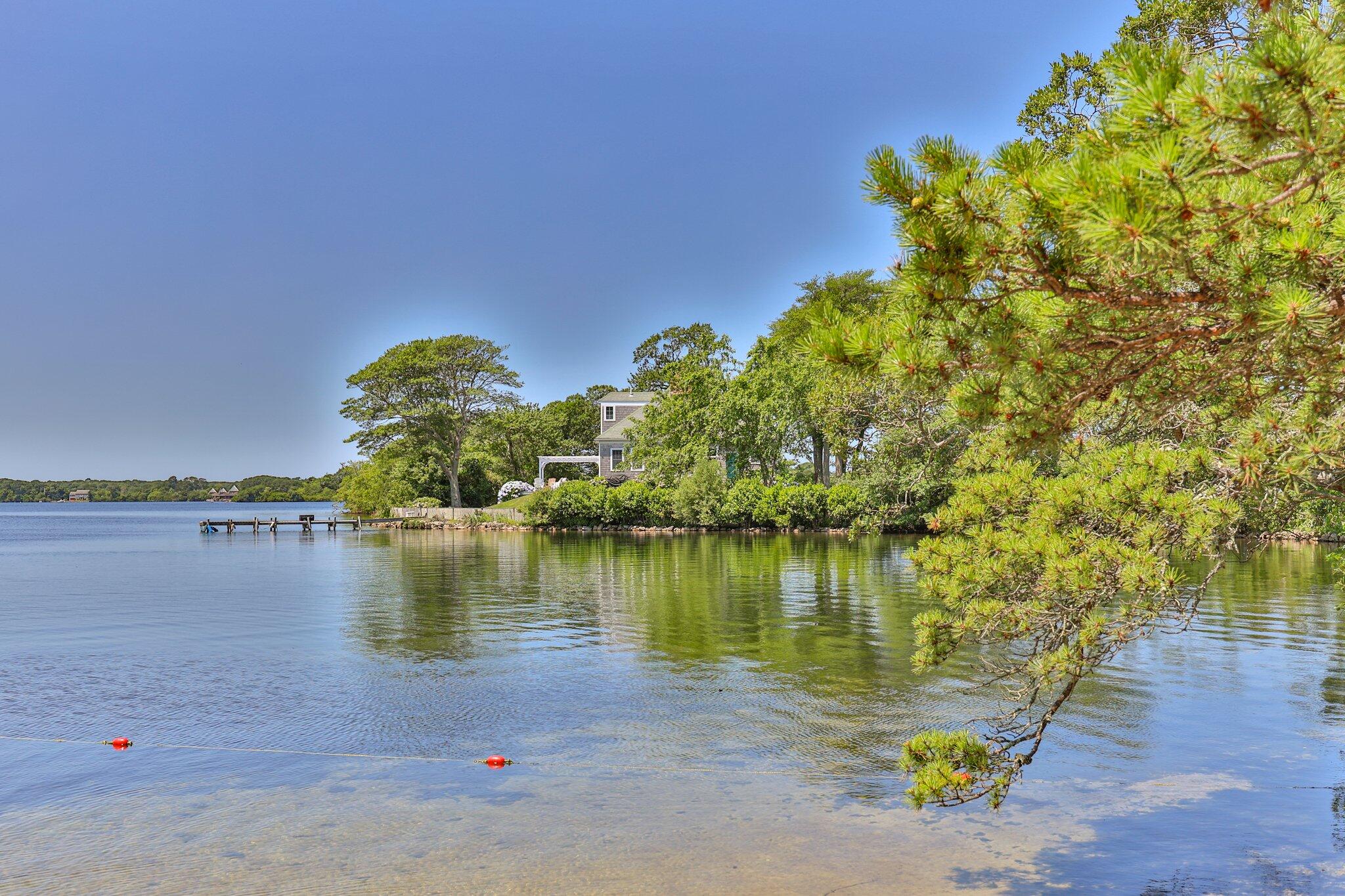 35 Angus Way Centerville, MA 02632 - Photo 52 of 62 a view of a lake with a mountain in the background