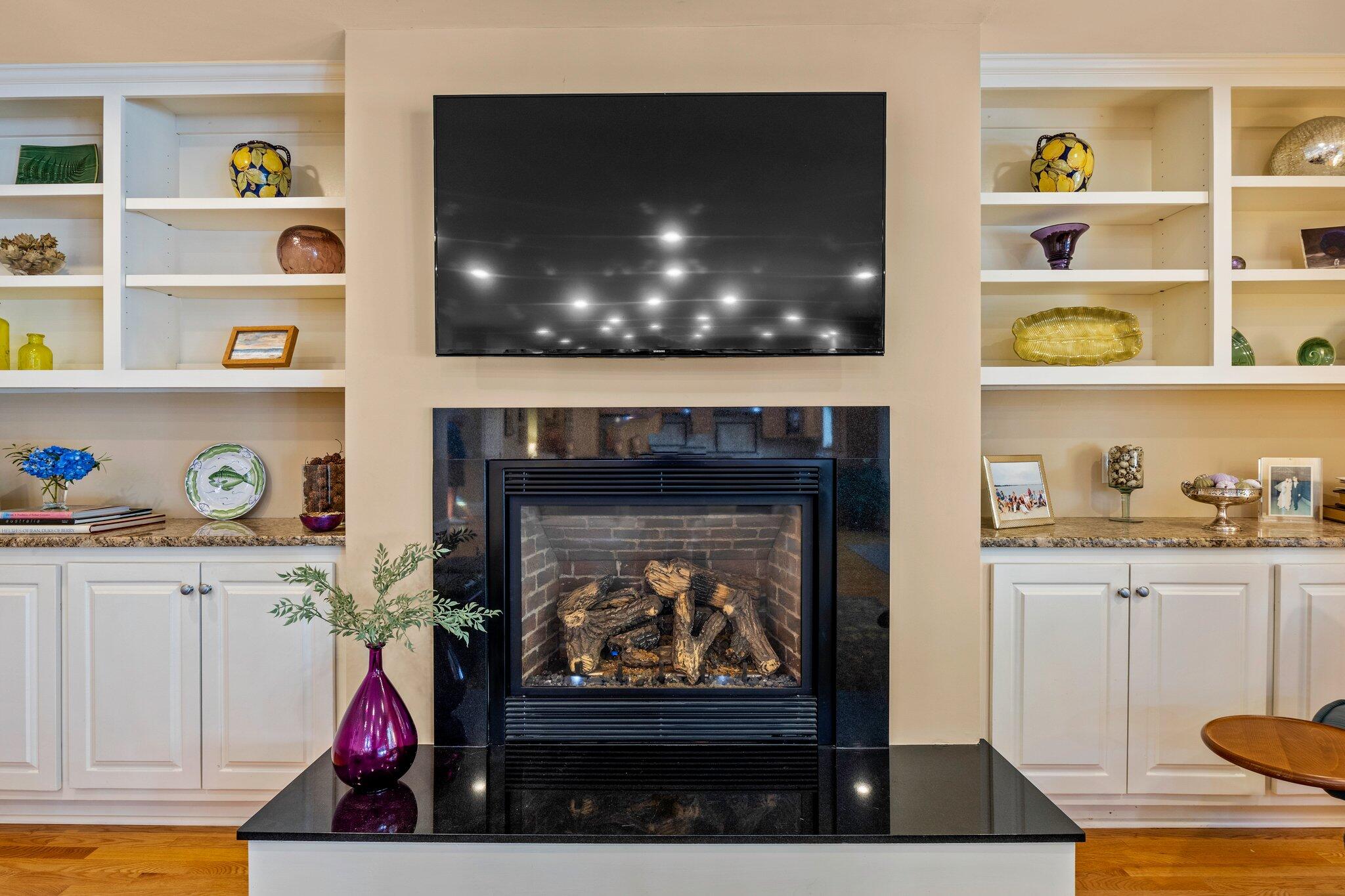 35 Angus Way Centerville, MA 02632 - Photo 7 of 62 a living room with fish tank and a fireplace