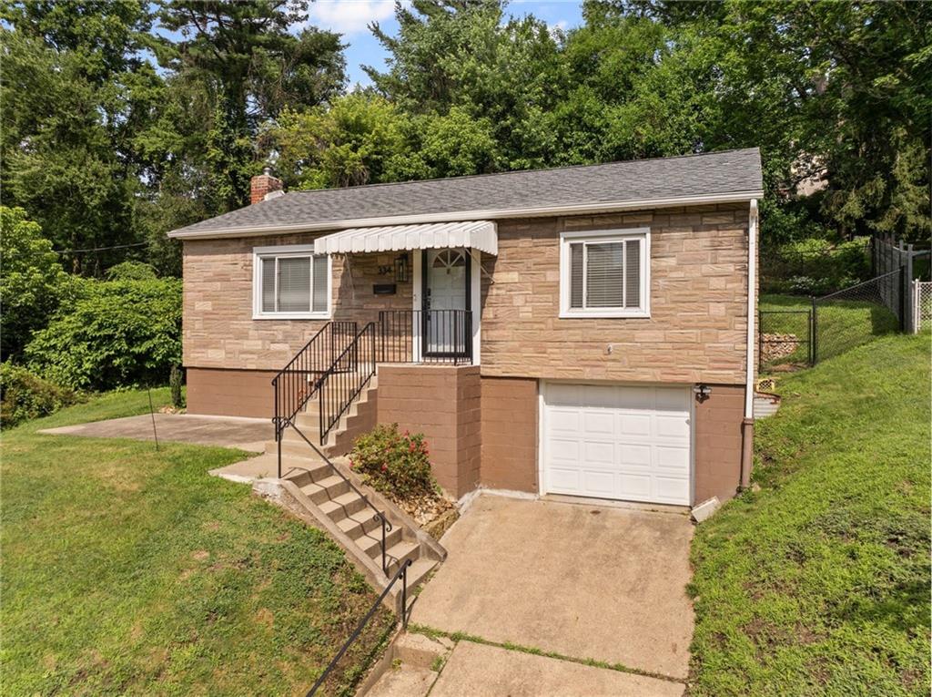334 Shaler Street Pittsburgh, PA 15211 - Photo 1 of 31 a view of a house with a yard