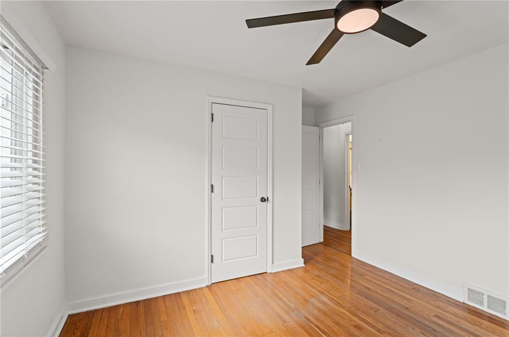 334 Shaler Street Pittsburgh, PA 15211 - Photo 20 of 31 a view of an empty room with wooden floor and a window