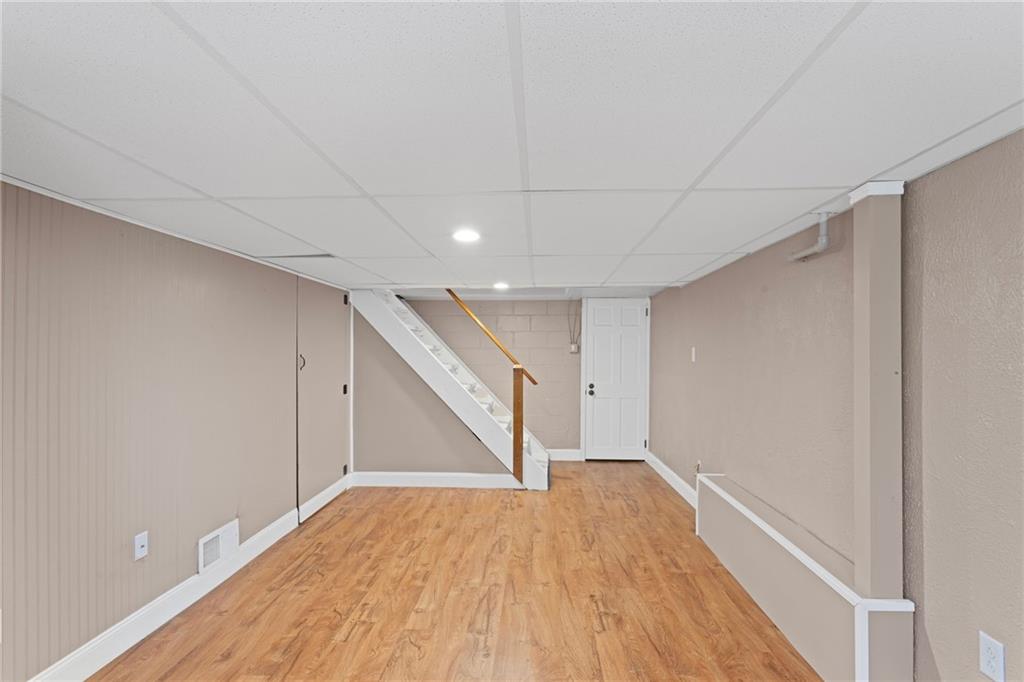 334 Shaler Street Pittsburgh, PA 15211 - Photo 26 of 31 a view of an empty room with wooden floor