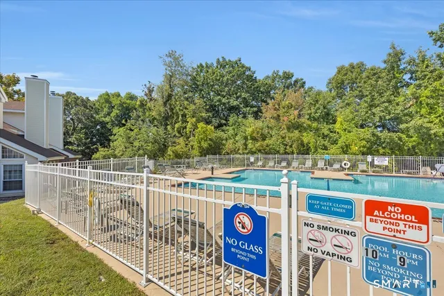 a view of a wooden fence with a city view