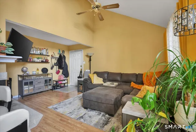 a living room with furniture and a flat screen tv