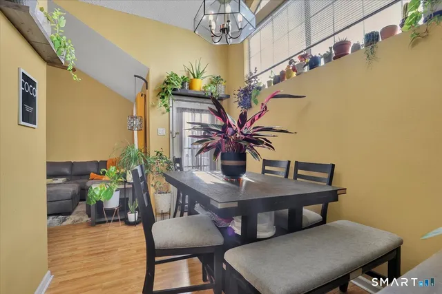 a view of a dining room with furniture and wooden floor