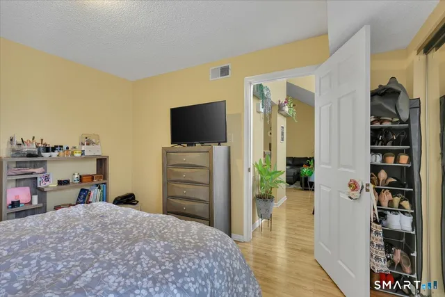 a room with furniture and a flat screen tv