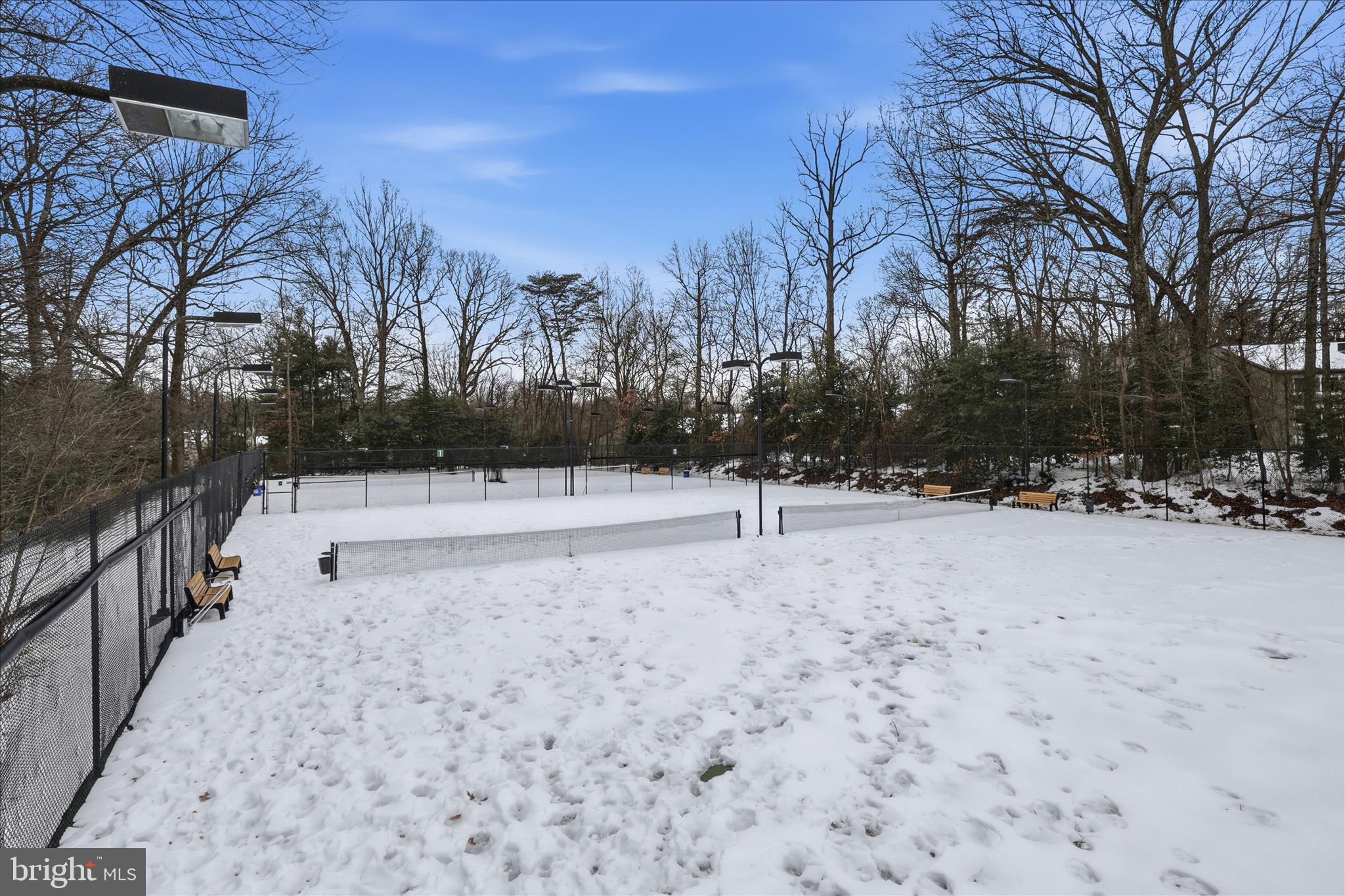 2255 Castle Rock Square, Unit 21C Reston, VA 20191 - Photo 26 of 33 a view of white house with snow on the road