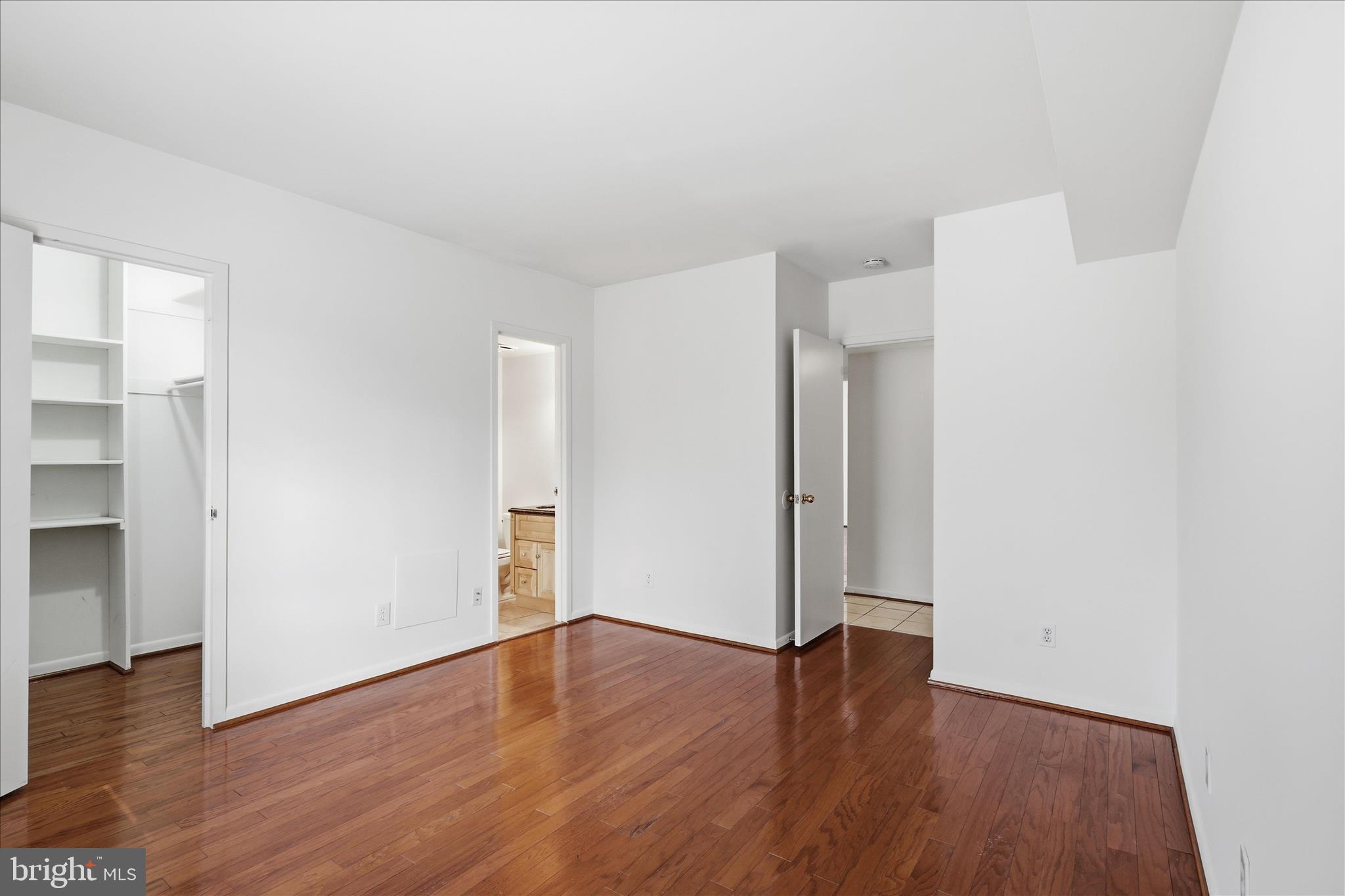 2255 Castle Rock Square, Unit 21C Reston, VA 20191 - Photo 10 of 33 a view of an empty room with wooden floor