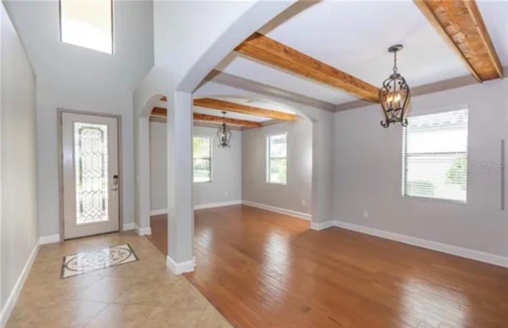 6914 Quiet Creek Drive Bradenton, FL 34212 - Photo 13 of 31 a view of livingroom with window and hardwood floor