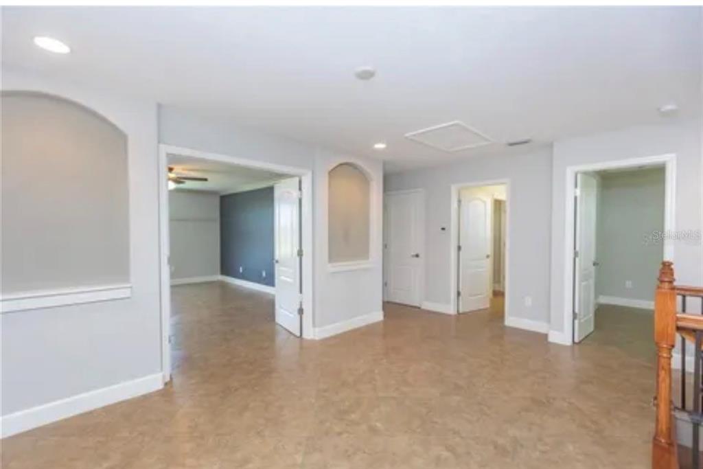 6914 Quiet Creek Drive Bradenton, FL 34212 - Photo 18 of 31 an empty room with closet and wooden floor