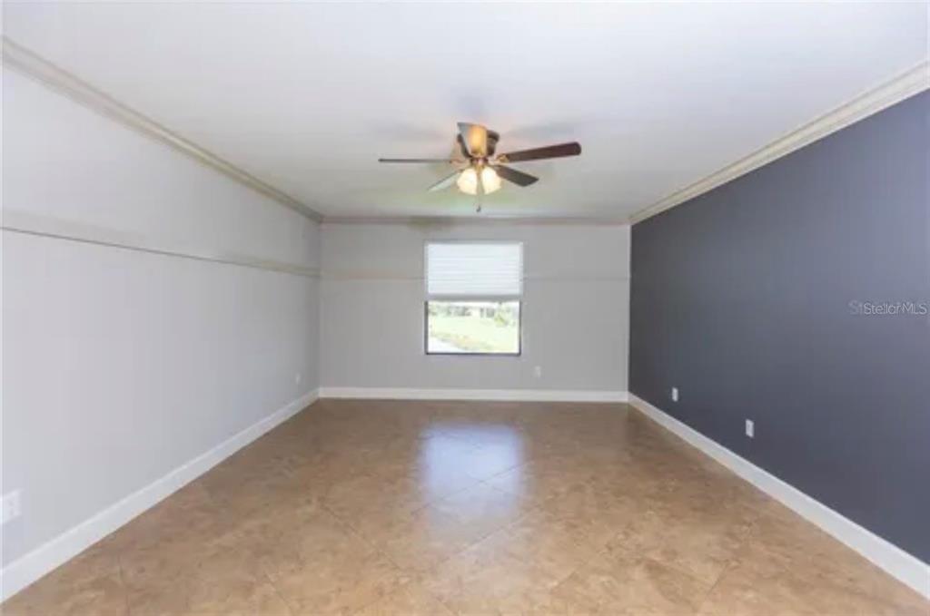 6914 Quiet Creek Drive Bradenton, FL 34212 - Photo 21 of 31 wooden floor in an empty room with a window