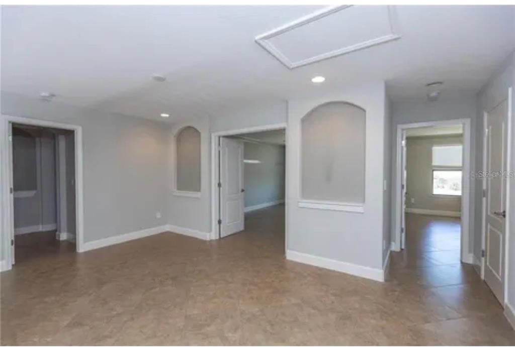 6914 Quiet Creek Drive Bradenton, FL 34212 - Photo 22 of 31 wooden floor and windows in a room