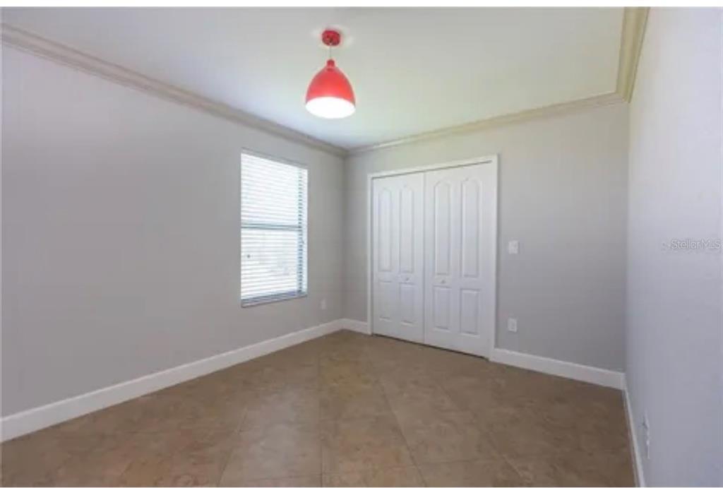 6914 Quiet Creek Drive Bradenton, FL 34212 - Photo 27 of 31 a view of an empty room with a window
