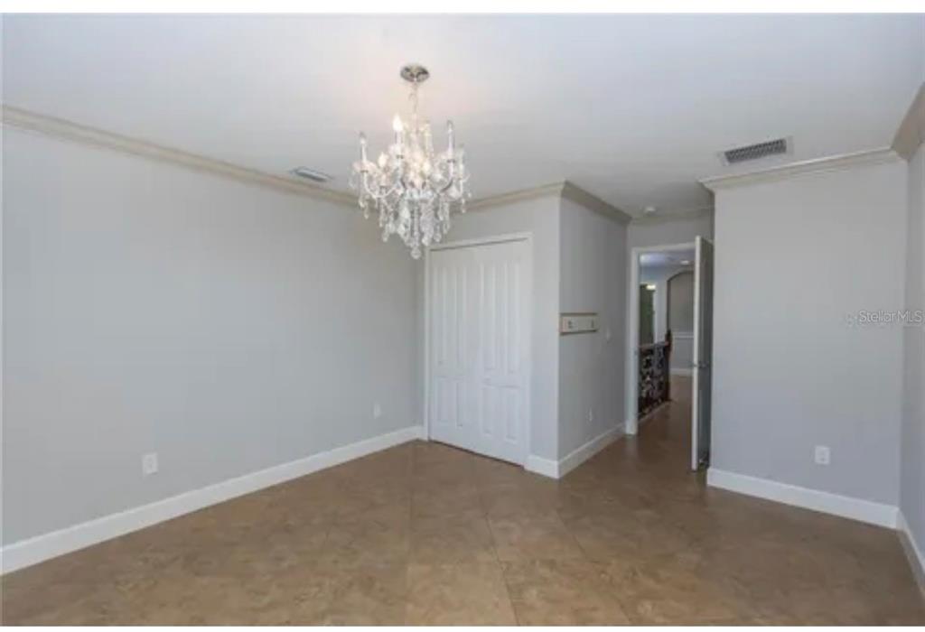6914 Quiet Creek Drive Bradenton, FL 34212 - Photo 28 of 31 a view of a chandelier in big room and chandelier