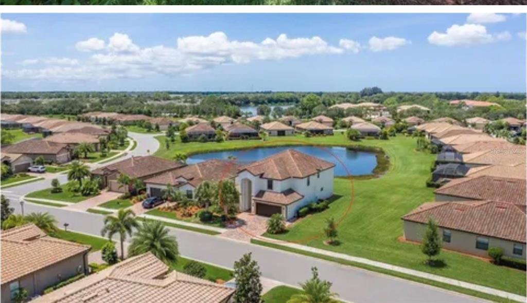 6914 Quiet Creek Drive Bradenton, FL 34212 - Photo 4 of 31 an aerial view of a house with a garden