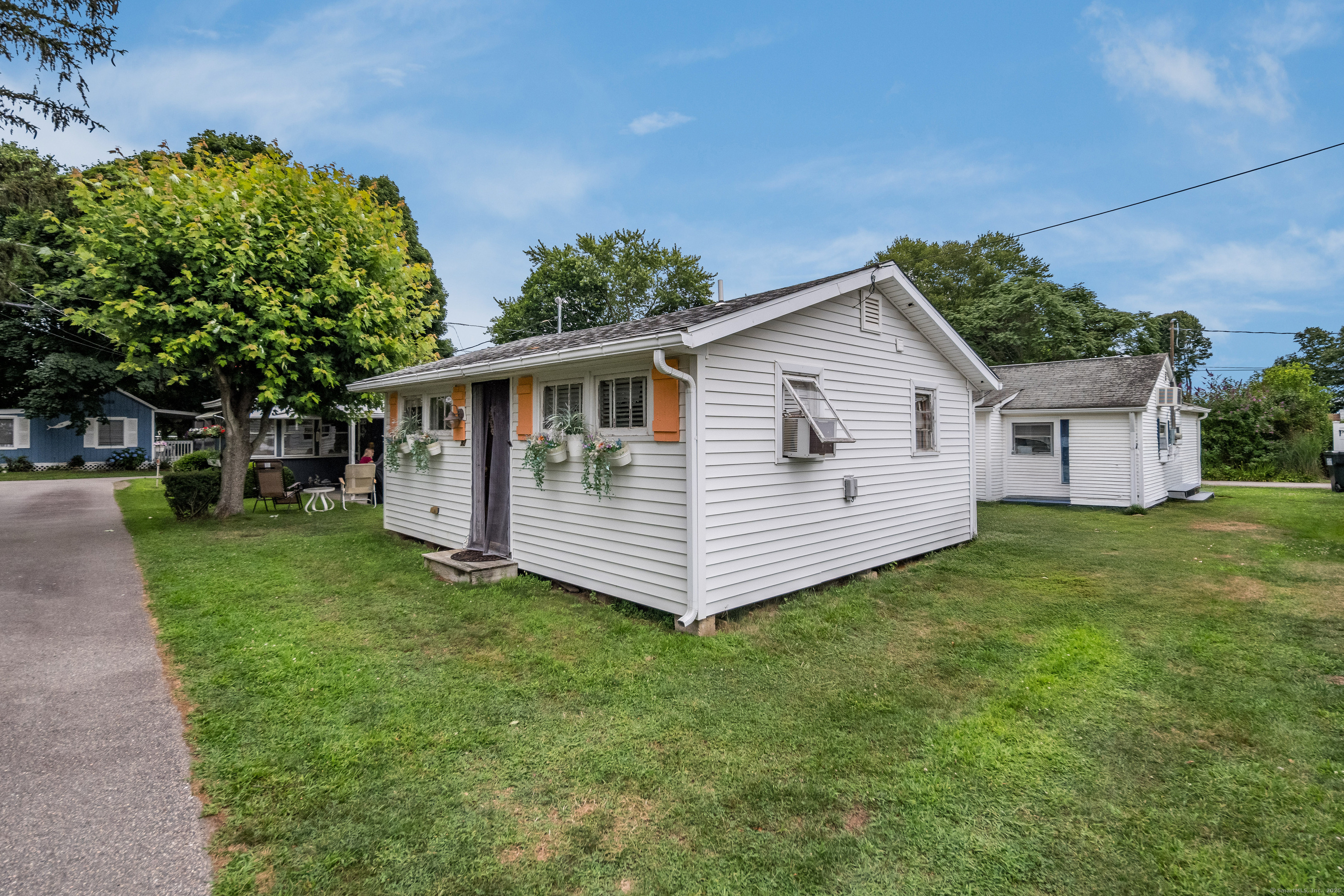 92 4th Avenue Madison, CT 06443 - Photo 15 of 19 a view of a house with a yard