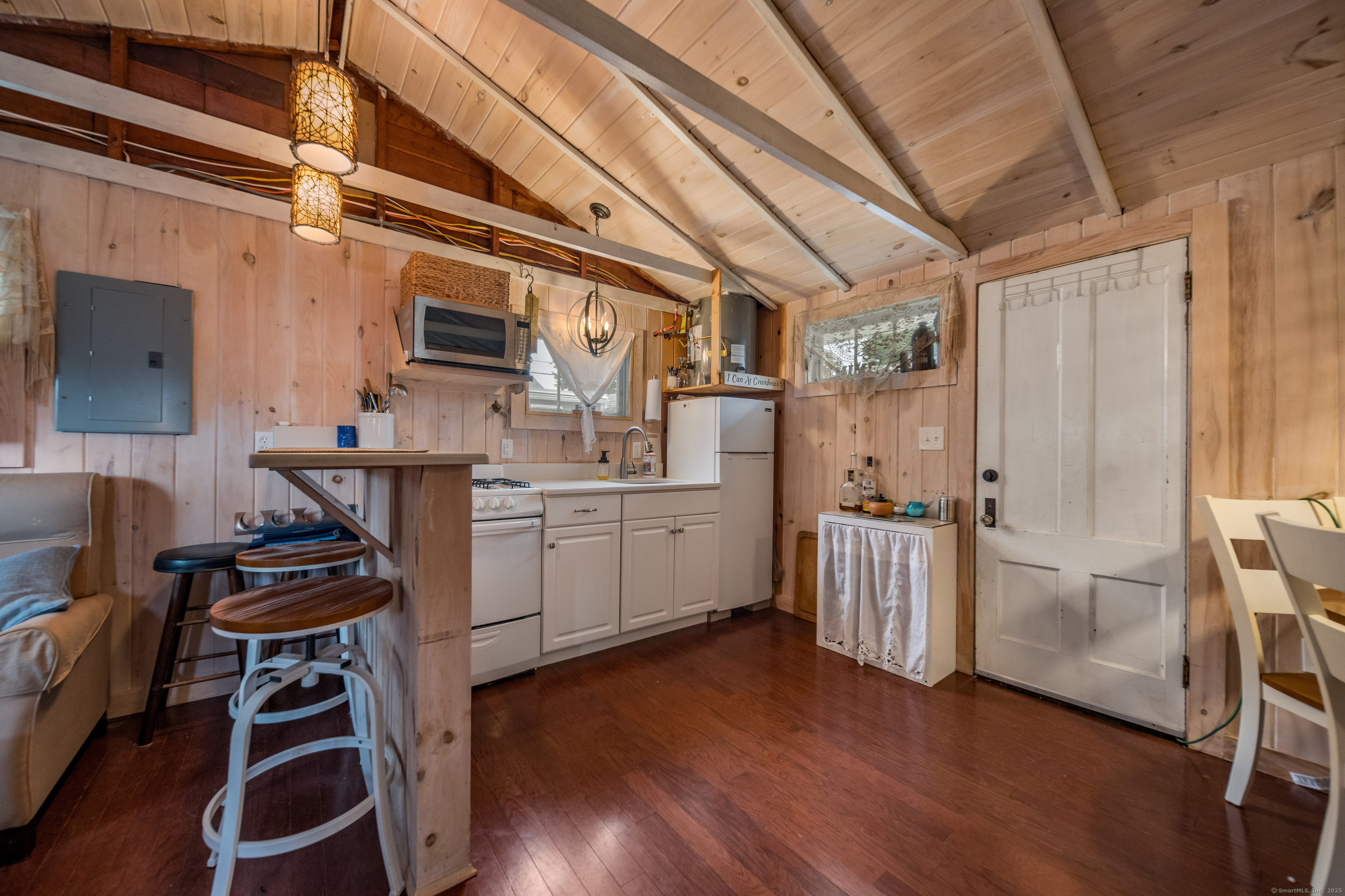 92 4th Avenue Madison, CT 06443 - Photo 4 of 19 a kitchen with sink cabinets and wooden floor