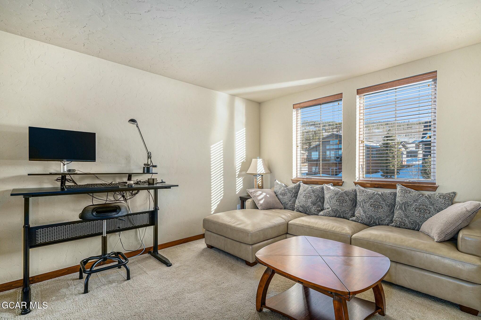 160 First Track Lane Granby, CO 80446 - Photo 17 of 27 a living room with furniture and a flat screen tv
