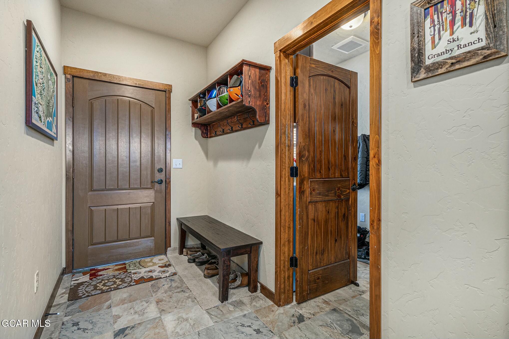 160 First Track Lane Granby, CO 80446 - Photo 5 of 27 a view of a hallway with a elevator
