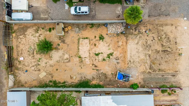 an aerial view of lake residential house with swimming pool and outdoor seating