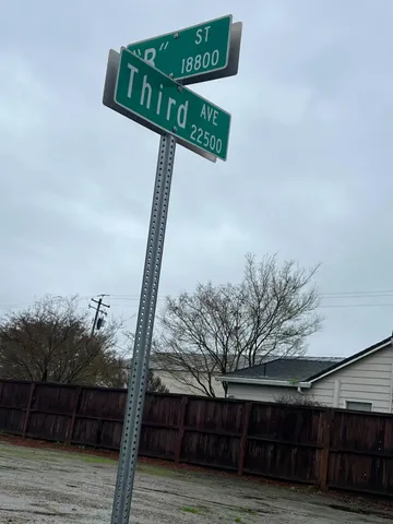 a street sign on a wooden floor