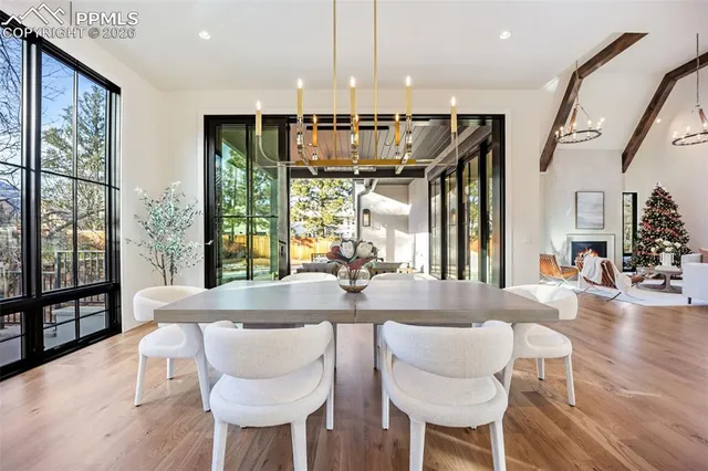 a dining room with furniture and wooden floor