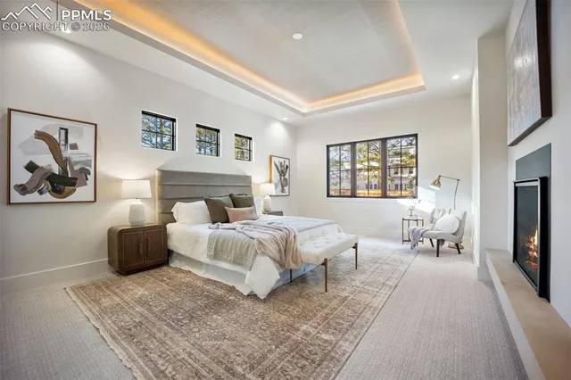 a bedroom with a large bed and a couch