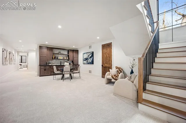 a living room with furniture and a table