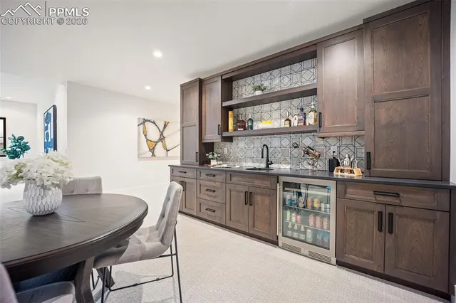 a kitchen with granite countertop a sink and cabinets