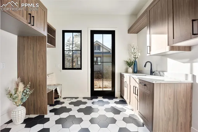 a kitchen with stainless steel appliances granite countertop a refrigerator and a stove