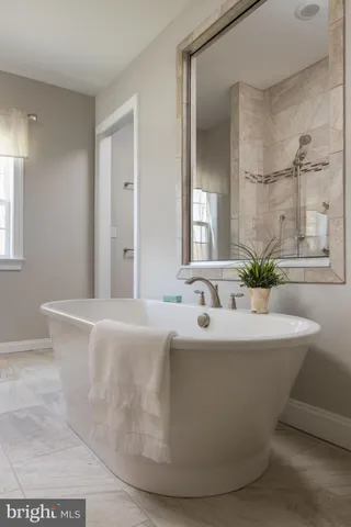 a white bath tub sitting in a bathroom